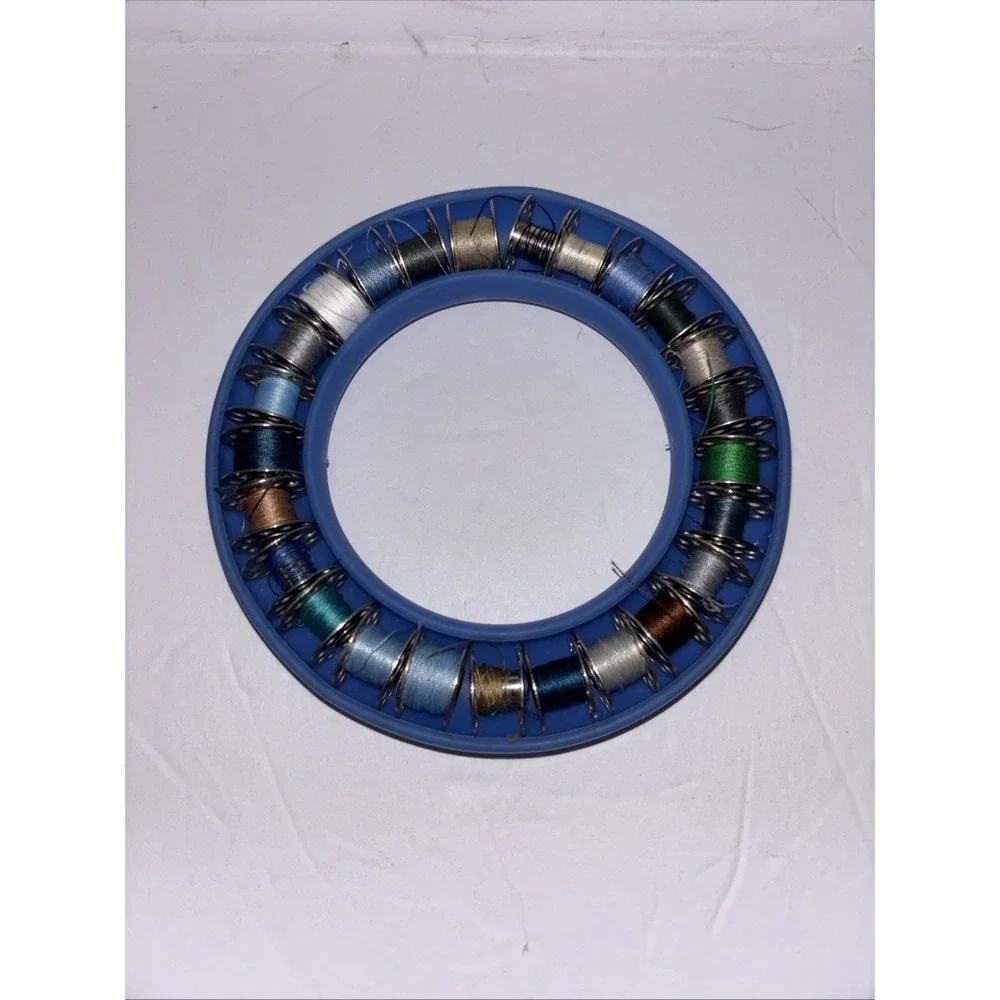 Lot of 25 Metal Bobbins & Blue Feather Bobbin Saver Holder